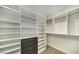 Walk-in closet with custom shelving and drawers for optimal storage at 900 Las Vegas Blvd # 912, Las Vegas, NV 89101