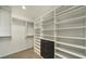 Well-organized walk-in closet featuring built-in shelving and ample storage space at 900 Las Vegas Blvd # 912, Las Vegas, NV 89101