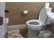 Powder bathroom includes toilet and sink at 9175 Titan Hill Ct, Las Vegas, NV 89148