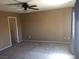 Bedroom with ceiling fan and neutral colored walls at 9175 Titan Hill Ct, Las Vegas, NV 89148