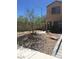 Charming home with low maintenance landscaping, featuring decorative rocks and desert plants at 9175 Titan Hill Ct, Las Vegas, NV 89148