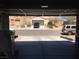 Open garage showing view of neighborhood at 9175 Titan Hill Ct, Las Vegas, NV 89148