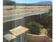 Backyard features desert landscaping and views of highway at 9175 Titan Hill Ct, Las Vegas, NV 89148