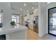 Bright kitchen showcasing a large island with a breakfast bar, stainless steel appliances, and modern finishes at 9425 Villa Ridge Dr, Las Vegas, NV 89134