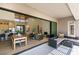 Spacious open concept living space with modern finishes, fireplace, dining area, and access to the outdoor patio at 9425 Villa Ridge Dr, Las Vegas, NV 89134