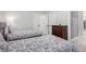 Bedroom with twin beds, a dresser, and a doorway leading to a bathroom at 9440 Grenville Ave, Las Vegas, NV 89134