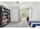 Bedroom with a twin bed, carpet floors, closet with slider doors, and exterior balcony at 9440 Grenville Ave, Las Vegas, NV 89134