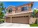 Beautiful two-story home with a three-car garage, updated windows and shutters at 9440 Grenville Ave, Las Vegas, NV 89134