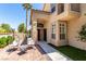 Inviting front porch with stylish hanging chairs and a modern brick patio at 9440 Grenville Ave, Las Vegas, NV 89134