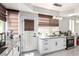 Bright kitchen area featuring granite countertops, stainless steel appliances, and a door to the outside at 9440 Grenville Ave, Las Vegas, NV 89134