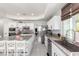 Well-lit kitchen with island seating, granite countertops, and stainless steel appliances at 9440 Grenville Ave, Las Vegas, NV 89134