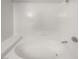 Bright bathroom with white tile surround and a luxurious soaking tub under a rainfall shower head at 950 Seven Hills Dr # 217, Henderson, NV 89052