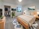 Bright bedroom featuring a walk-in closet, a queen bed, and modern decor at 950 Seven Hills Dr # 217, Henderson, NV 89052