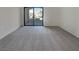 Bedroom featuring new carpet and sliding glass door to balcony at 950 Seven Hills Dr # 217, Henderson, NV 89052