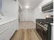 Modern kitchen with stainless steel range and view to living room at 950 Seven Hills Dr # 217, Henderson, NV 89052