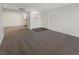 Bright, open living room features neutral carpet and a view to the kitchen at 950 Seven Hills Dr # 217, Henderson, NV 89052