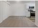 Open living room with modern kitchen and white sliding closet doors at 950 Seven Hills Dr # 217, Henderson, NV 89052
