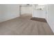 Spacious living room with neutral carpet and white walls at 950 Seven Hills Dr # 217, Henderson, NV 89052