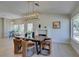 The dining room has ample natural light, an elegant light fixture, and views to the kitchen at 9520 Sundial Dr, Las Vegas, NV 89134