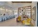 Inviting open-concept living space with an eat-in kitchen, seating area, and decorative shelving at 9520 Sundial Dr, Las Vegas, NV 89134