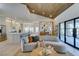 Spacious living room boasts an open layout, curved couch, and easy access to the gourmet kitchen at 9520 Sundial Dr, Las Vegas, NV 89134