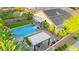 Aerial view of a sparkling pool and spa, covered patios, landscaping, and solar at 9685 Stonily Ln, Las Vegas, NV 89178