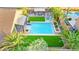 Bird's eye view of a private backyard featuring a sparkling pool and a covered outdoor kitchen at 9685 Stonily Ln, Las Vegas, NV 89178