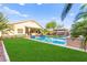Expansive backyard showcases a serene pool and covered patio, blending leisure with outdoor living at 9685 Stonily Ln, Las Vegas, NV 89178