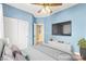 Virtually staged bedroom with closet, flat screen tv, mounted chest, and white trim at 9685 Stonily Ln, Las Vegas, NV 89178
