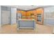 Kitchen featuring stainless steel appliances, kitchen island, and tile floors at 9685 Stonily Ln, Las Vegas, NV 89178