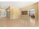 Open living room featuring tile floors and many entry points to the home at 9685 Stonily Ln, Las Vegas, NV 89178