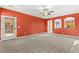Spacious carpeted living room with access to the patio at 9685 Stonily Ln, Las Vegas, NV 89178