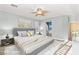 Serene bedroom with soft lighting, comfortable bed, and ensuite bathroom access, creating a relaxing retreat at 9685 Stonily Ln, Las Vegas, NV 89178