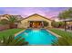 Inviting backyard pool with covered patio, outdoor seating, and lush landscaping, a perfect oasis at 9685 Stonily Ln, Las Vegas, NV 89178