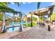 Inviting backyard spa with an elegant cabana and outdoor dining area, creating a resort-like ambiance at 9685 Stonily Ln, Las Vegas, NV 89178