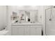 Bright bathroom with double sink vanity, and glass shower enclosure at 9743 Mojave Mountain St, Las Vegas, NV 89166