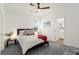 Comfortable bedroom featuring a ceiling fan, carpeted floors, and modern decor at 9743 Mojave Mountain St, Las Vegas, NV 89166