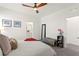 This bedroom features a comfortable bed, modern ceiling fan, ensuite bathroom, and ample closet space at 9743 Mojave Mountain St, Las Vegas, NV 89166