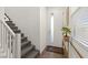 Inviting entryway with staircase, showcasing natural light and convenient access to upper levels at 9743 Mojave Mountain St, Las Vegas, NV 89166