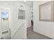 Upstairs hallway with easy access to laundry room and bedrooms, promoting efficient living space at 9743 Mojave Mountain St, Las Vegas, NV 89166