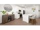 Bright kitchen with white cabinets, a center island with seating, and modern stainless steel appliances at 9743 Mojave Mountain St, Las Vegas, NV 89166