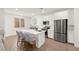 Modern kitchen with white cabinets, stainless steel appliances, and a large island at 9743 Mojave Mountain St, Las Vegas, NV 89166