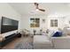 Cozy living room with a large TV, comfortable seating, and natural light at 9743 Mojave Mountain St, Las Vegas, NV 89166
