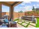 Relaxing patio with cushioned seating, a built-in barbecue, and lush greenery for outdoor enjoyment at 9743 Mojave Mountain St, Las Vegas, NV 89166