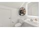 Stylishly decorated powder room with unique shelving and modern sink, adding charm to the home at 9743 Mojave Mountain St, Las Vegas, NV 89166