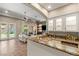 Entertainer's wet bar featuring glass cabinets, granite counters, and built in dishwasher at 9747 Cathedral Pines Ave, Las Vegas, NV 89149
