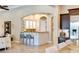 Wet bar featuring unique cabinet design, granite counter, and stylish seating at 9747 Cathedral Pines Ave, Las Vegas, NV 89149
