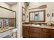 Nautical themed bathroom with vanity, shower and seaside decor at 9747 Cathedral Pines Ave, Las Vegas, NV 89149