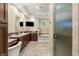 Modern bathroom features dual vanities, soaking tub, and glass-enclosed shower at 9747 Cathedral Pines Ave, Las Vegas, NV 89149