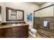 Bathroom featuring single sink vanity and a shower with glass doors at 9747 Cathedral Pines Ave, Las Vegas, NV 89149